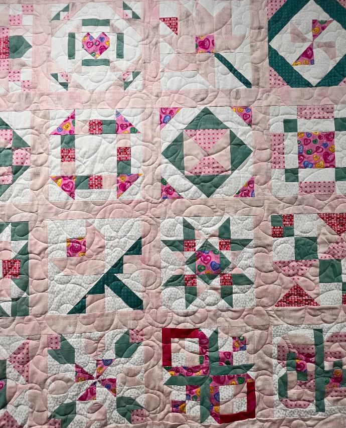 Sampler quilt in pink and green